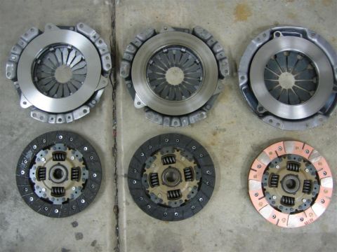 1987 Suzuki Samurai - Collection of clutch assemblies and discs, likely for automotive repair or upgrade.