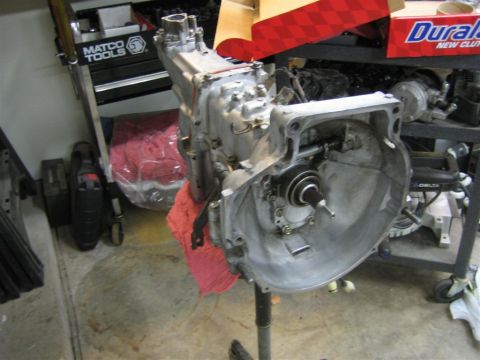 1987 Suzuki Samurai - Transmission assembly on a stand, with a Matco Tools chest visible in the background.