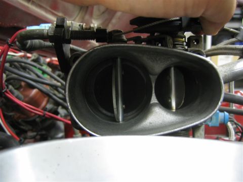 1987 Suzuki Samurai - Close-up view of a throttle body, likely from an older vehicle's engine bay.