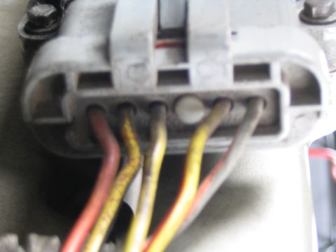 1993 Ford Taurus - Electrical connector with multiple wires, likely from a vehicle's wiring harness.