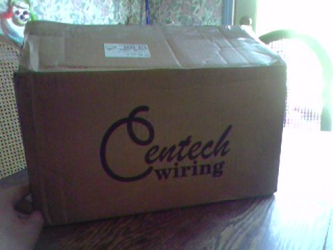 1974 Ford Bronco - A cardboard box with the Centech wiring logo is placed on a table.