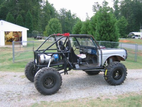 1992 Ford Mustang - Custom buggy built from a 1974 Ford Bronco chassis with a roll cage and large off-road tires.