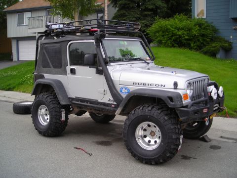 2003 Jeep TJ - Silver 2003 Jeep TJ Rubicon modified with a snorkel and roof rack.