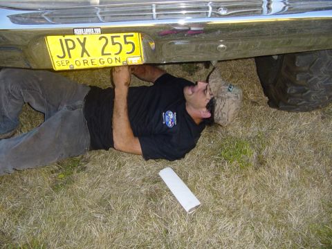 1989 Ford Bronco - Jim cleaning under his truck, getting ready for the drags
