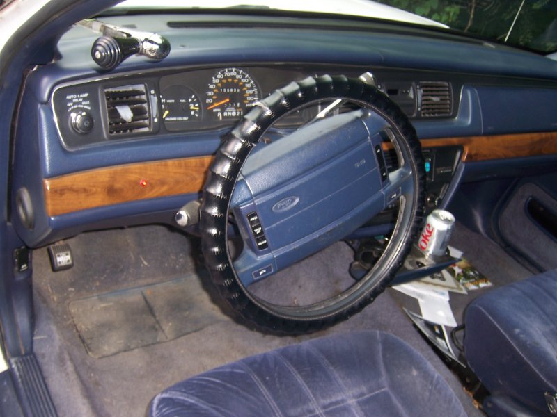 1994 Ford Crown Victoria interior with blue seats and wood trim