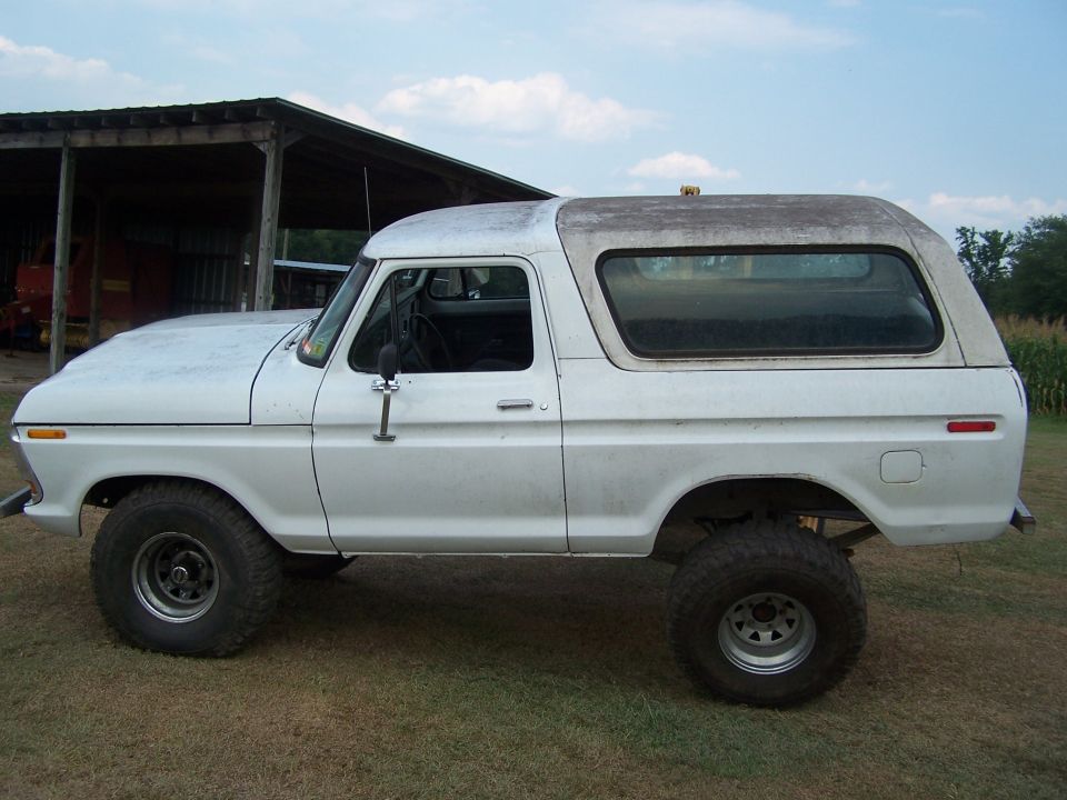 White 1979 Ford Bronco side view, lifted with off-road tires