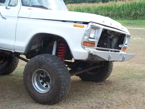 1979 Ford Bronco - Front view of a lifted 1979 Ford Bronco with off-road tires and a custom bumper.