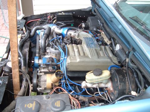 1990 Ford Ranger - Close-up of a V8 engine in a vehicle's engine bay, a prominent intake manifold.