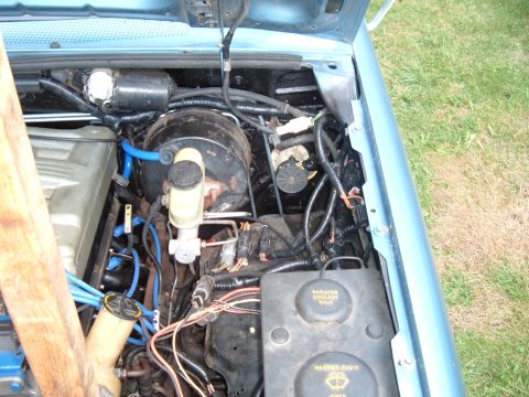 1990 Ford Ranger - Close-up view of the engine bay, showing various components and fluid reservoirs.