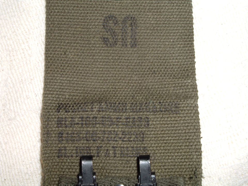 Green canvas strap with US marking and metal clasps