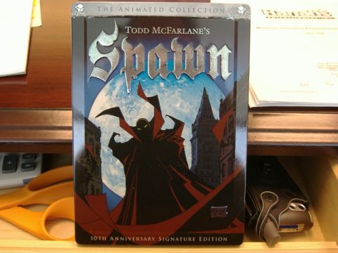 1991 Ford Bronco - Spawn The Animated Collection DVD case is shown on a wooden shelf with other items.