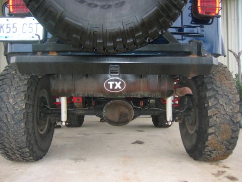 2001 Jeep Wrangler - This Jeep Wrangler is viewed from the rear, highlighting its tires and a Texas state sticker on the bumper.