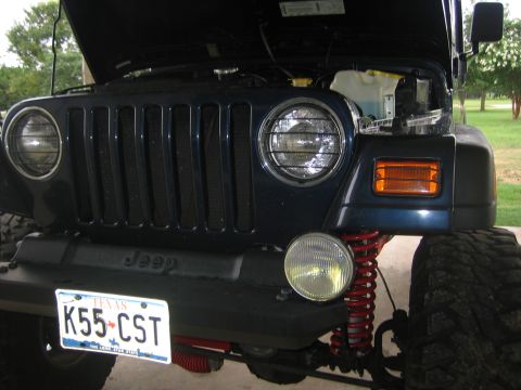 2001 Jeep Wrangler - Front view of a 2001 Jeep Wrangler showing the grille, headlights, and a Texas license plate.