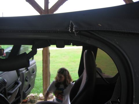 2001 Jeep Wrangler - Torn soft top on a 2001 Jeep Wrangler, viewed from the interior looking towards the passenger side.
