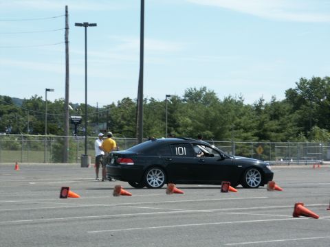 2001 Mercury Grand Marquis - A black sedan with racing number 101 is seen on an asphalt lot with traffic cones.