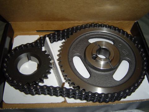 1978 Ford Bronco - A timing chain and two gears are shown inside a cardboard box.