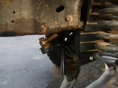 1991 Ford Bronco - Undercarriage view showing steering linkage and suspension parts.
