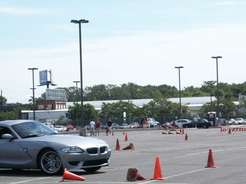 2001 Mercury Grand Marquis - Silver BMW Z4 at an event with other vehicles and traffic cones visible.