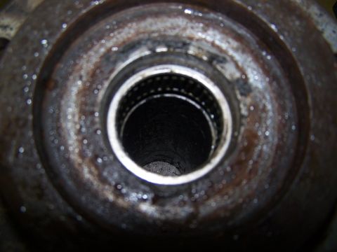 1979 Ford Bronco - A close-up view of a rusty metal hub, revealing internal splines.