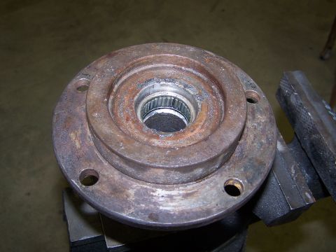 1979 Ford Bronco - A close-up view of a rusty wheel hub assembly, showing wear and tear on the metal components.