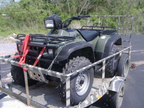 1999 Honda FOURTRAX FOREMAN S - An olive green ATV, identified as a Foreman 5, is strapped to a trailer for transport.