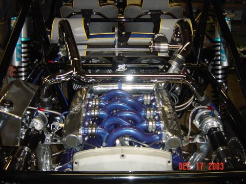 1993 Ford Taurus - Custom engine bay features a blue intake manifold and chrome piping, with a date stamp from 2003.