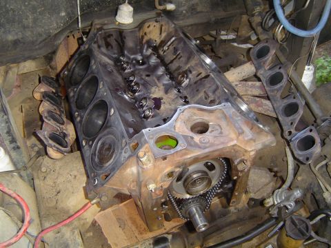 1978 Ford Bronco - The engine block is disassembled, showing internal components like the timing chain and gears.