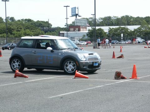 2001 Mercury Grand Marquis - Gray Mini Cooper with blue number 219 on the side, parked on asphalt with orange cones during an event.