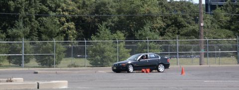 2001 Mercury Grand Marquis - A black sedan navigates an autocross course, marked with the number 279 on its door.