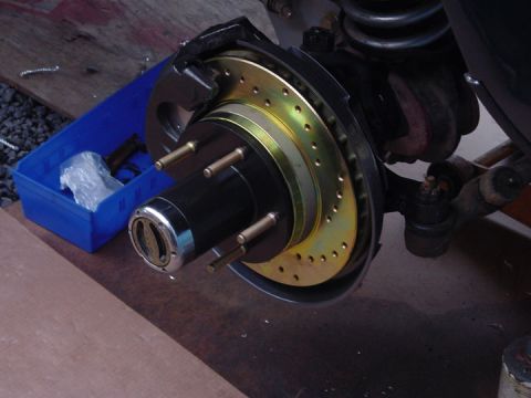 1979 Ford Bronco - This is a close-up of a vehicle's brake assembly, showing the hub and drilled rotor.