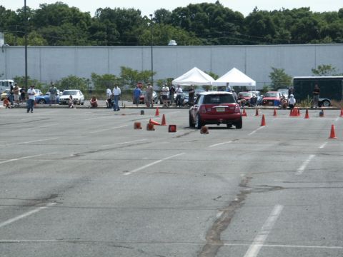 2001 Mercury Grand Marquis - Autocross event with multiple cars and people gathered in a parking lot.