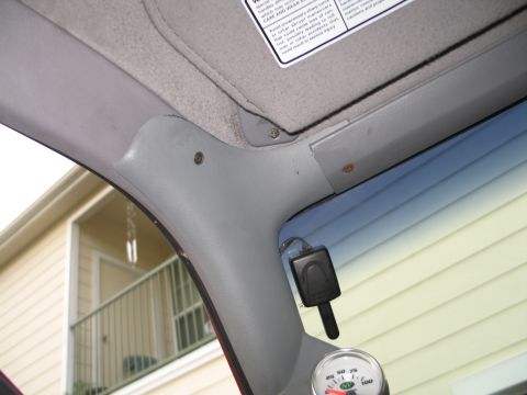1995 Ford Bronco - Interior view shows a gauge and accessory plug mounted near the A-pillar.