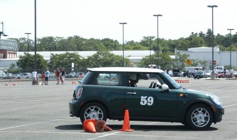 2001 Mercury Grand Marquis - A green Mini Cooper with a white roof and the number 59 on its door is seen at an autocross event.
