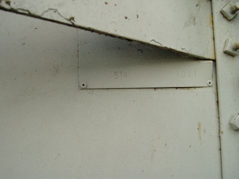 2000 Ford E350 - Metal plate with stamped identification numbers 'ST4' and '1011' visible on a painted surface.
