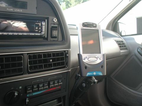 1990 Ford Thunderbird - Interior view of a car's dashboard, a mounted PDA and climate controls.