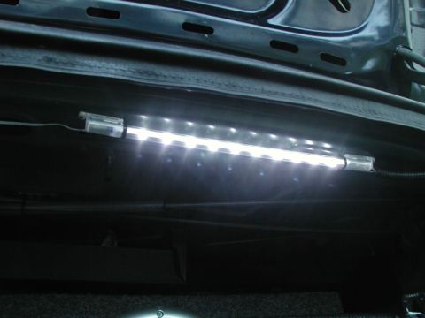 1990 Ford Thunderbird - An aftermarket LED light strip is installed in the trunk of a vehicle.