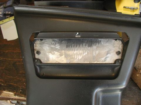 1990 Ford Thunderbird - Close-up of a car's interior ashtray switch panel, showing the cigarette lighter symbol.