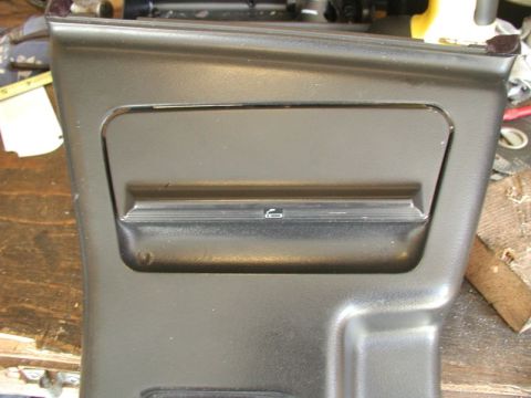 1990 Ford Thunderbird - This is a close-up of a car's interior ashtray panel, not a 1990 Ford Thunderbird.
