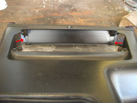 1990 Ford Thunderbird - This photo shows a close-up of a vehicle's ashtray switch panel, with red arrows pointing to mounting points.