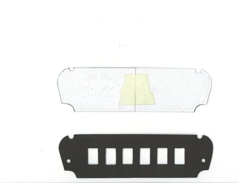 1990 Ford Thunderbird - A template and a black panel with cutouts, likely for a car's ashtray switch area.