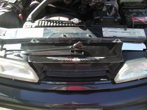 1990 Ford Thunderbird - Front view of a 1990 Ford Thunderbird, showing the grille, headlights, and engine compartment.
