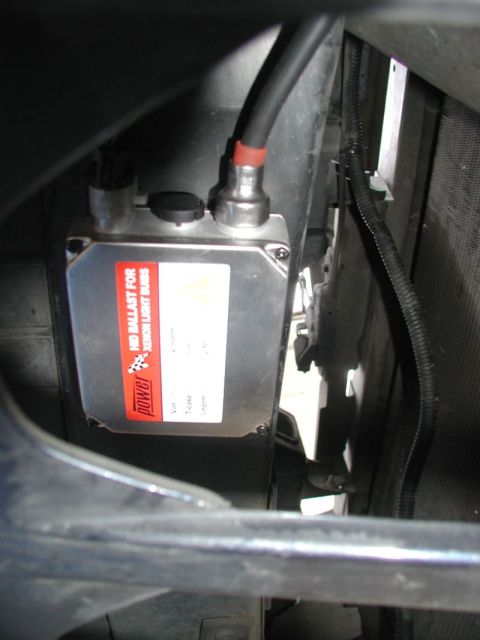1990 Ford Thunderbird - Close-up of an aftermarket HID ballast unit for xenon light bulbs.