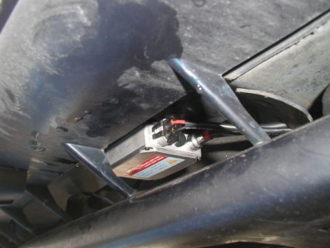 1990 Ford Thunderbird - This photo shows an HID ballast and associated wiring, likely for headlights, mounted beneath a vehicle.