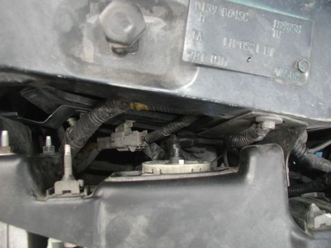 1990 Ford Thunderbird - A close-up view of vehicle wiring and a metal identification plate is visible.