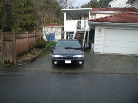 1990 Ford Thunderbird - Front view of a 1990 Ford Thunderbird parked in a residential driveway.