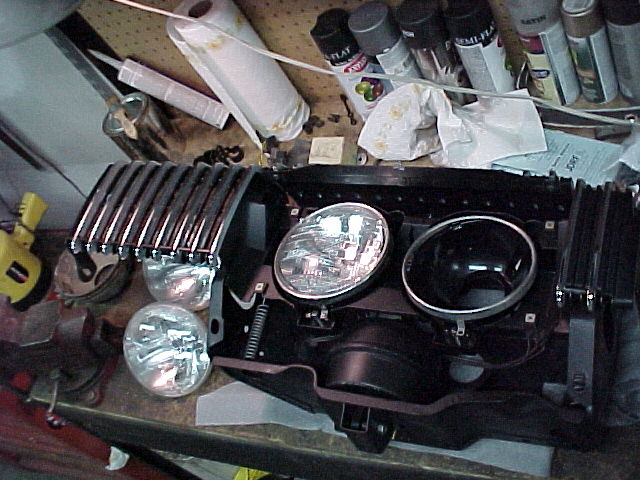 I restored all the individual pieces in the grille structure and the headlight motors were rebuilt with new accordian seals. All new hardware was used.