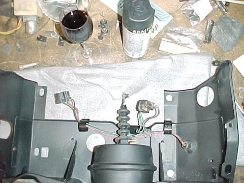 1967 Mercury Cougar - A brake booster assembly is laid out on a workbench, surrounded by tools and a glass of red wine.