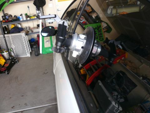 1996 Ford Probe - Suction cup mount attached to a car's side window in a garage setting.