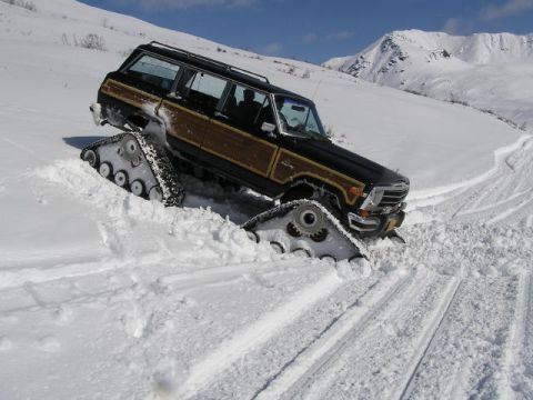 2000 Ford E350 - This Jeep Grand Wagoneer is equipped with snow tracks for off-road winter travel.