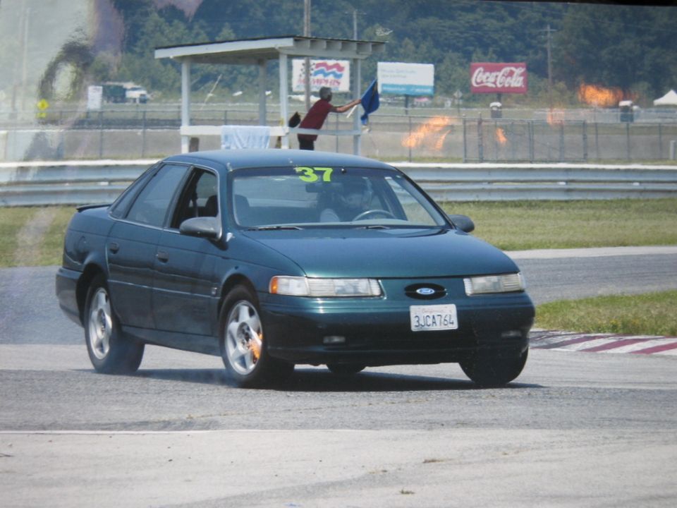 1997 Ford Taurus on track, number 37 on windshield, license plate 3JCA764
